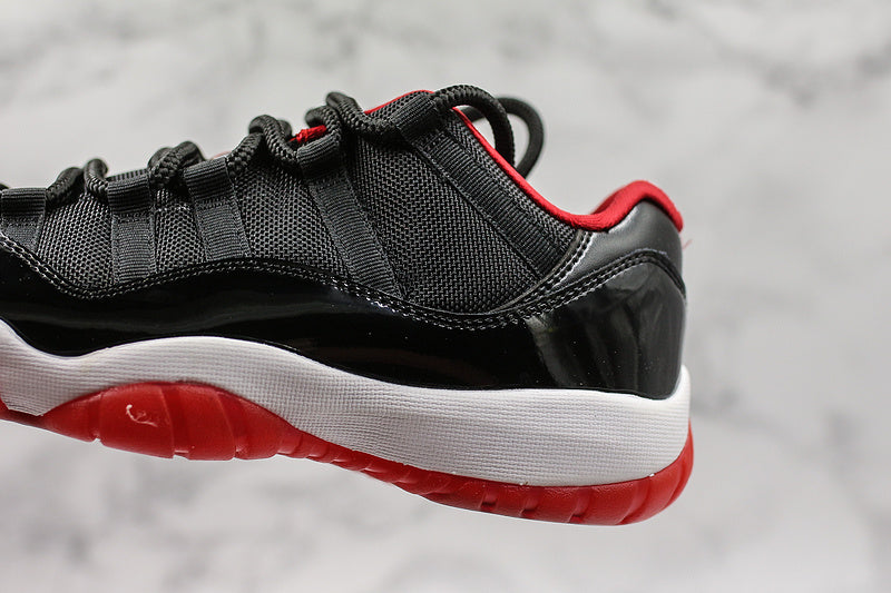 Nike Air Jordan 11 Retro Low-Top Bred Black Sneakers