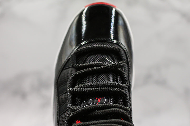 Nike Air Jordan 11 Retro Low-Top Bred Black Sneakers